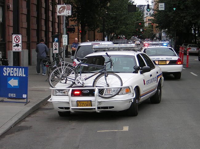 cop cars surrounding the suspect