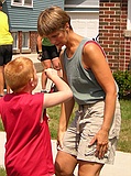 Kathy admiring Jack's autograph on the hand of a fan (named Nate?) in Manitowoc
